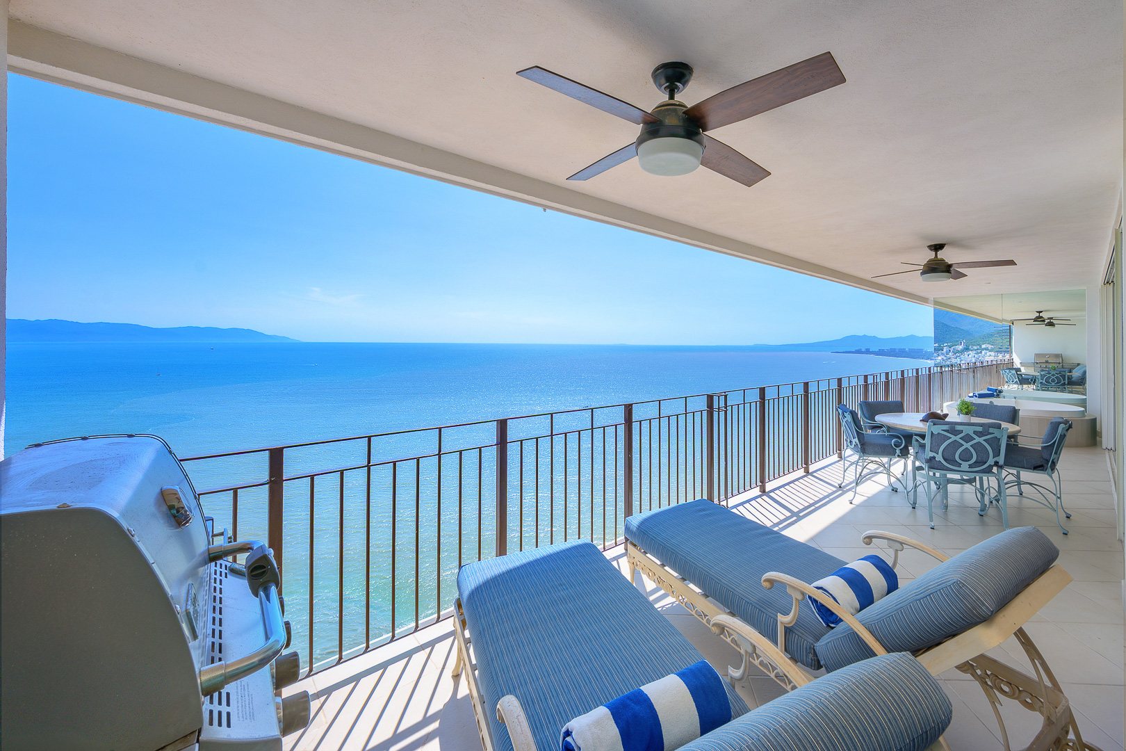 Sun loungers and grill along the ocean terrace