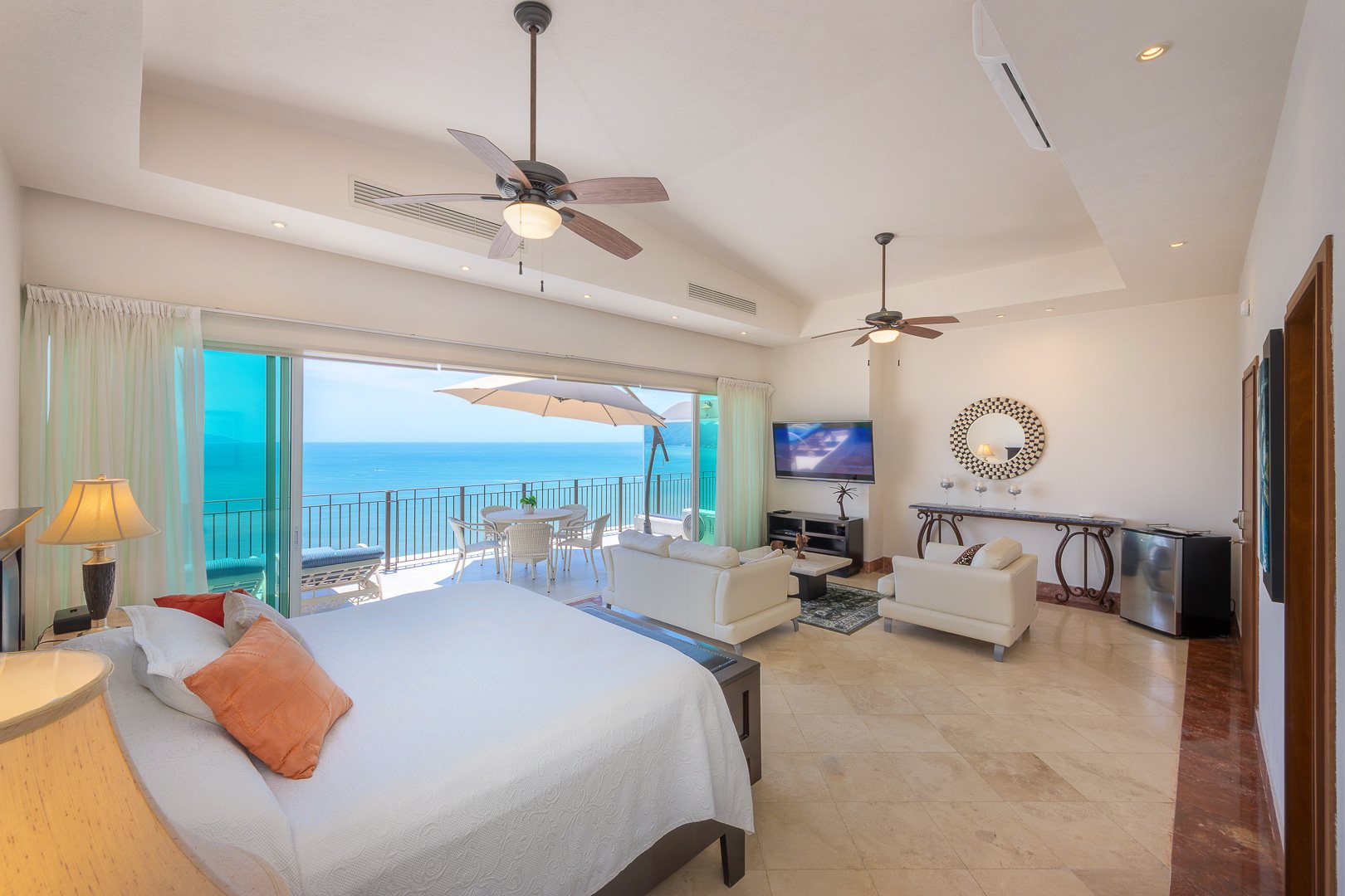 Primary suite on the upper floor, open to its private terrace