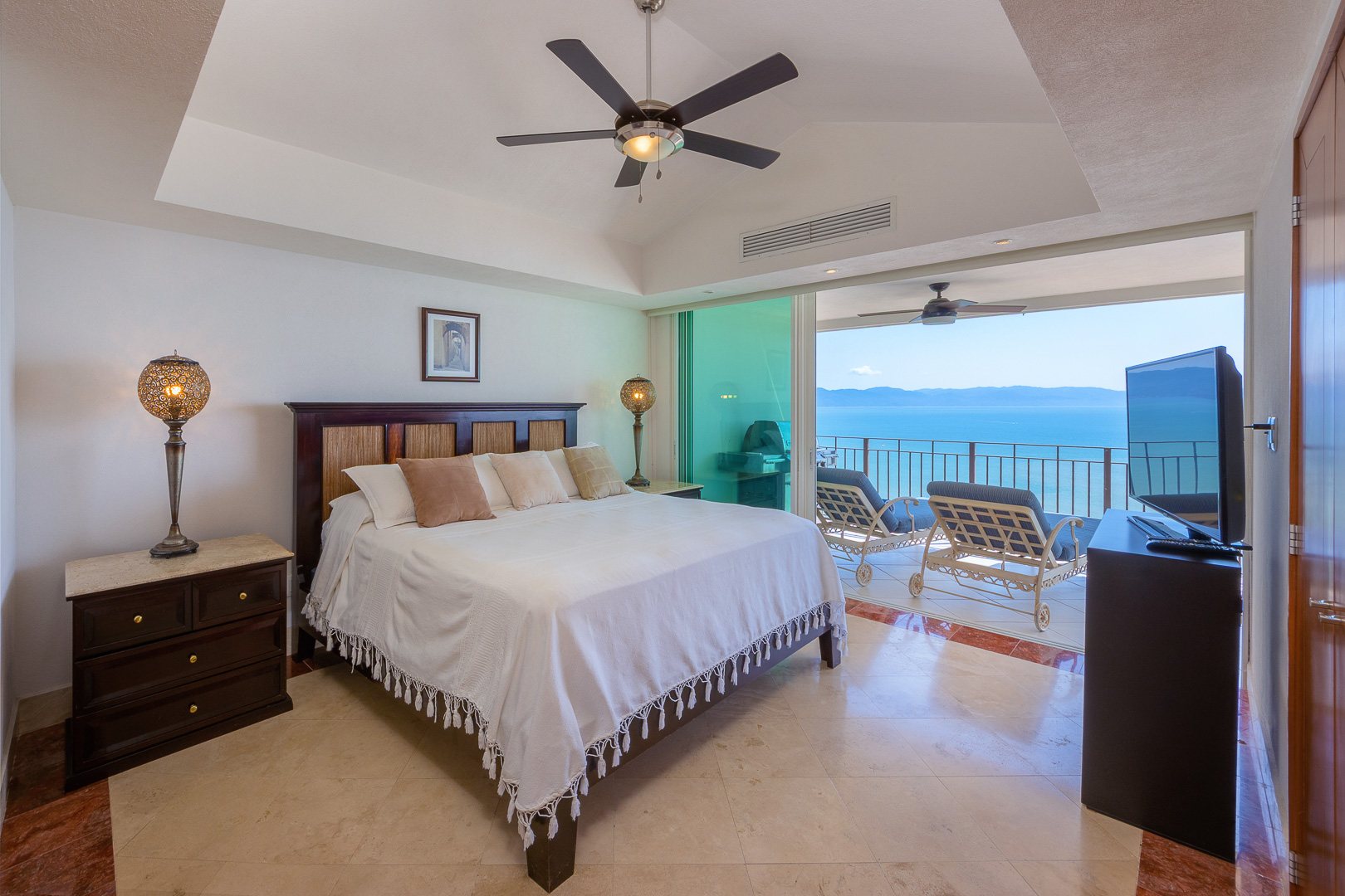 Bedroom opening to the ocean terrace