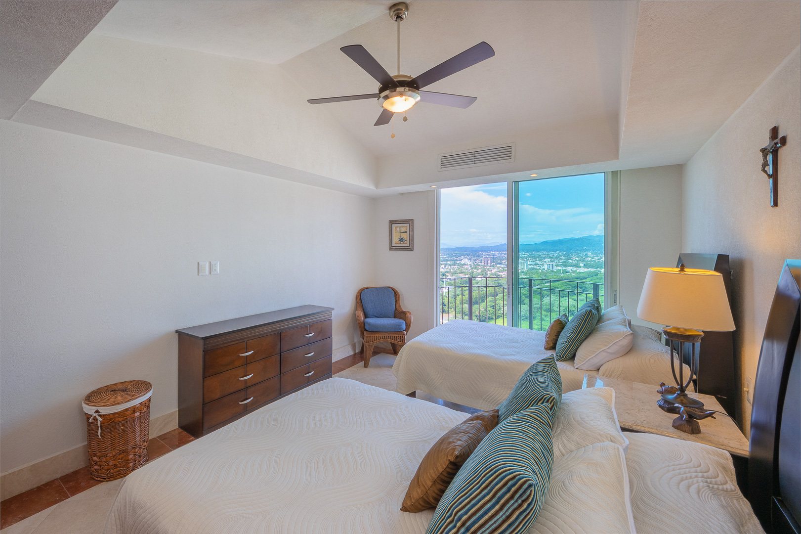 Bedroom with a city and mountain view