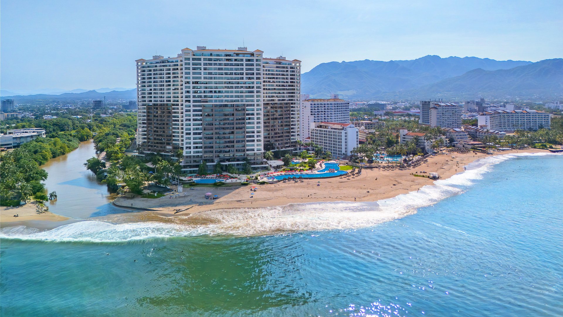 Aerial view of Grand Venetian, the beach and the river mouth