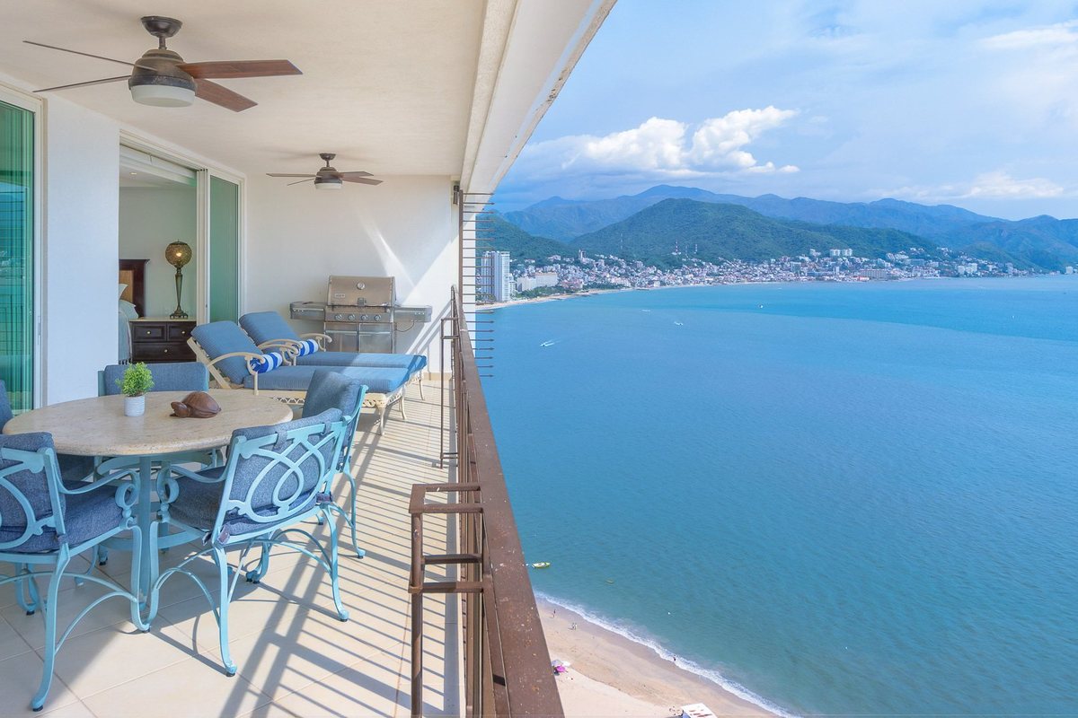 Ocean terrace of Grand Venetian Penthouse PH1-03 looking across Banderas Bay to Puerto Vallarta