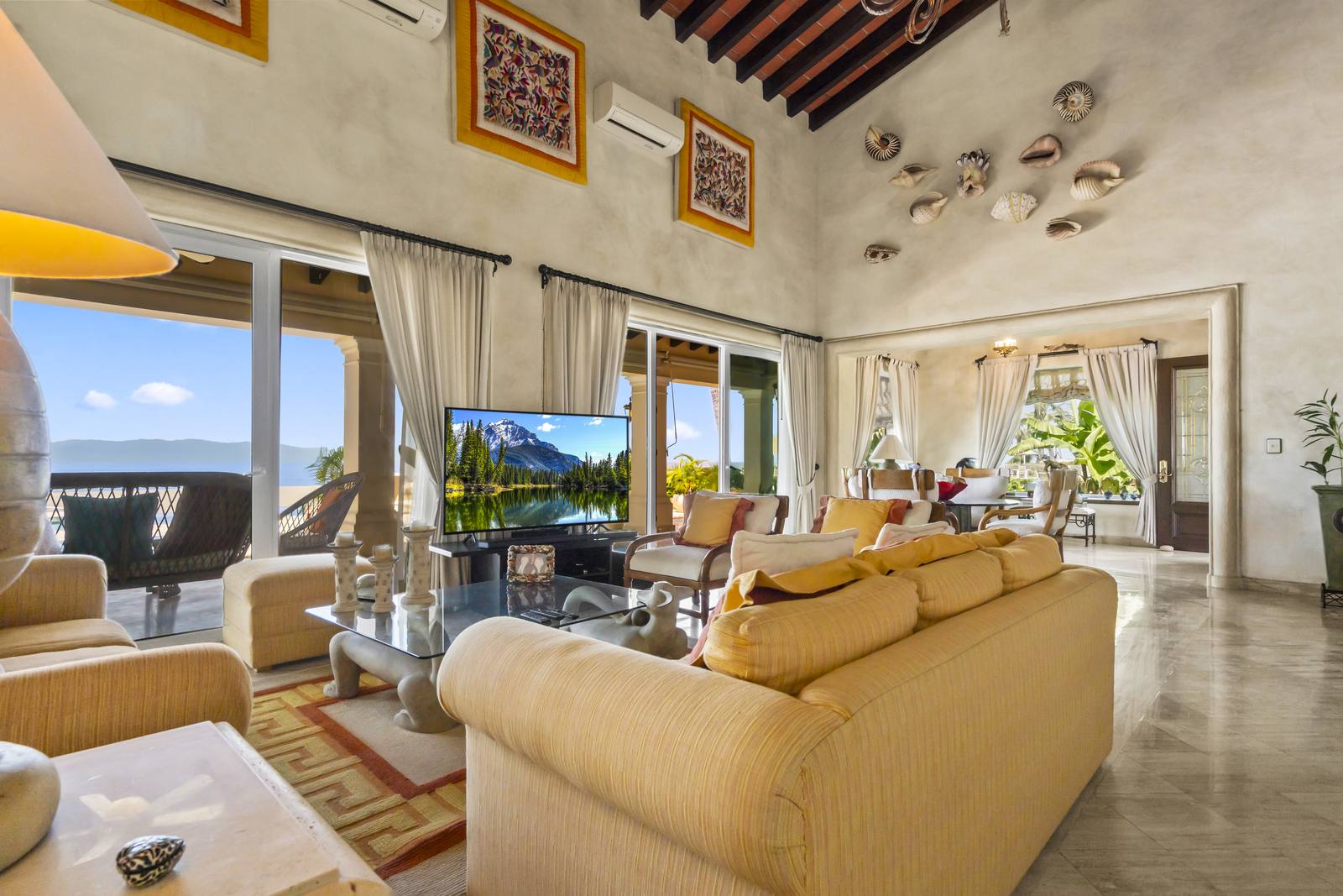 Living room with ocean views through floor-to-ceiling sliding doors