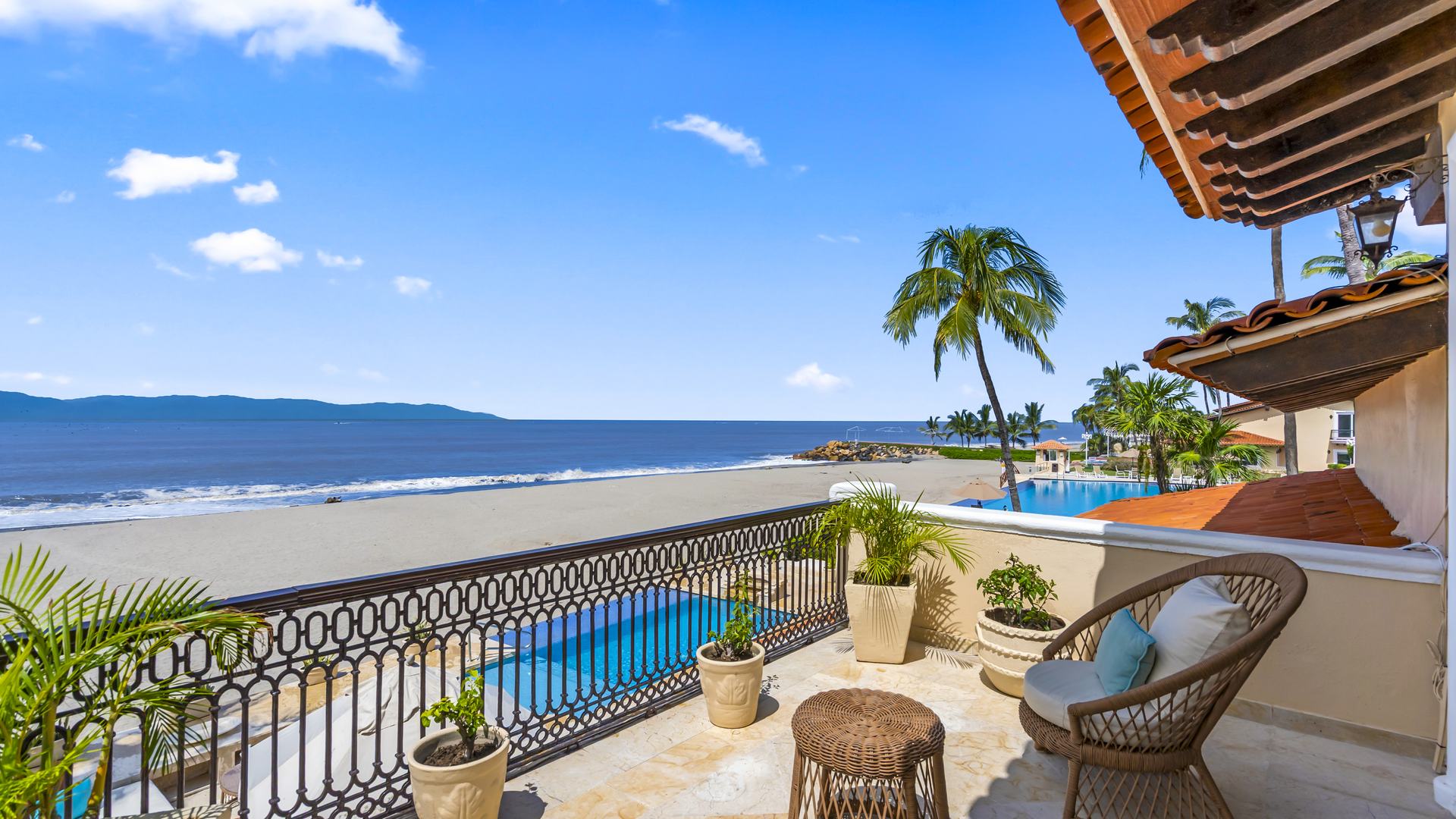 Upper terrace overlooking the private pool, the beach and Banderas Bay