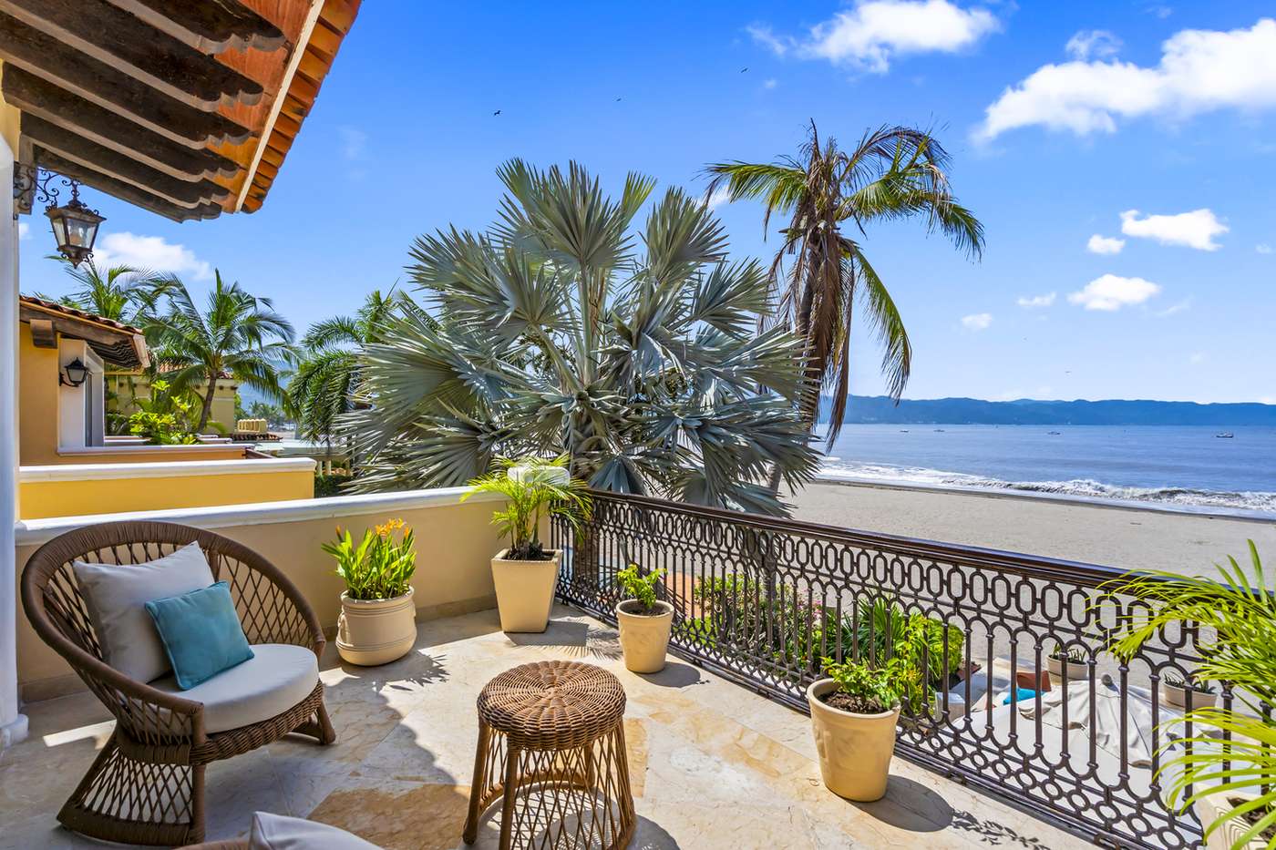 Upper terrace seating with views of the beach and the bay