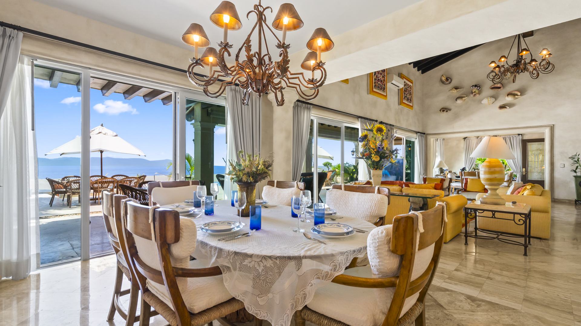 Dining room with ocean views and doors to the terrace