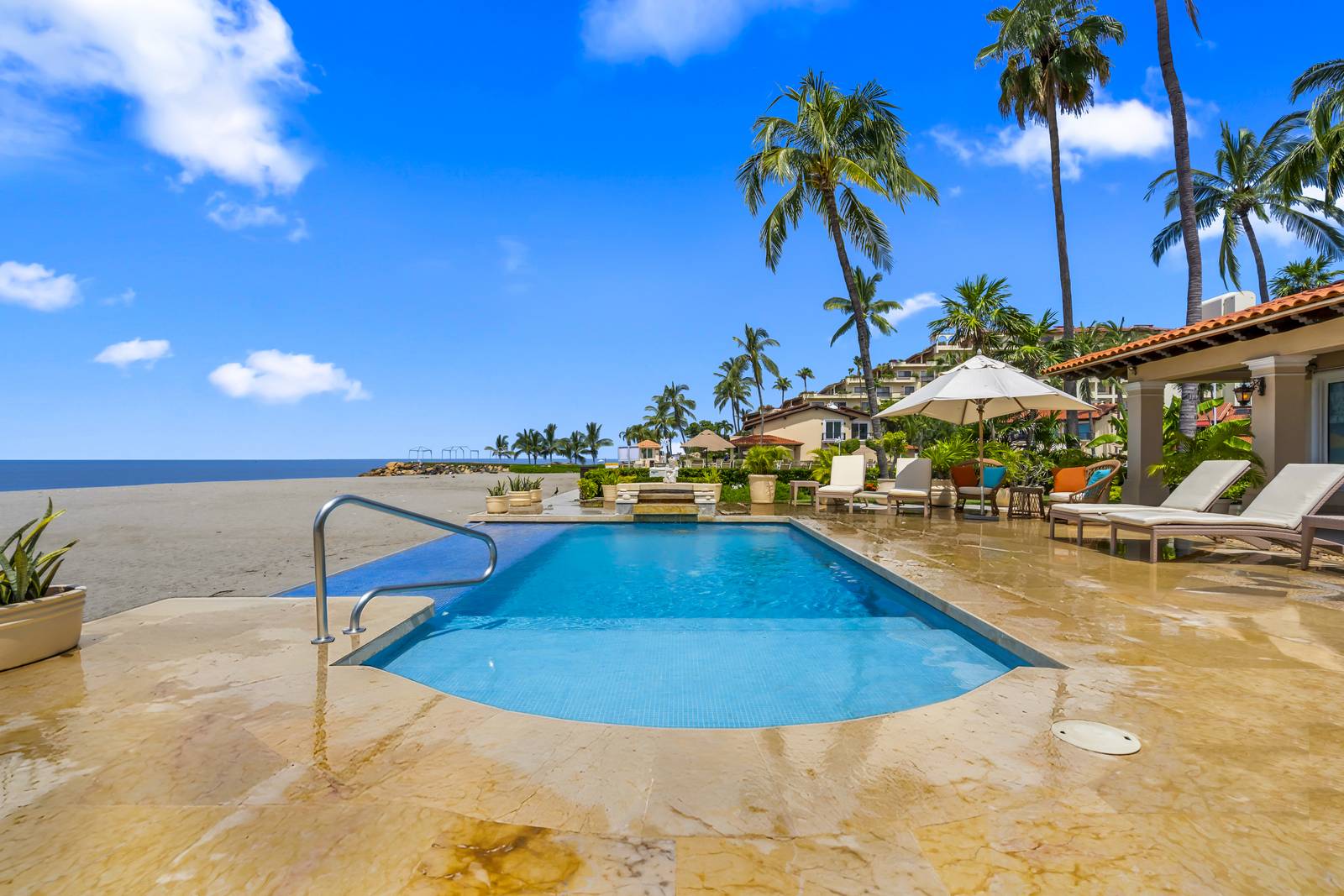 Private pool at the edge of the beach