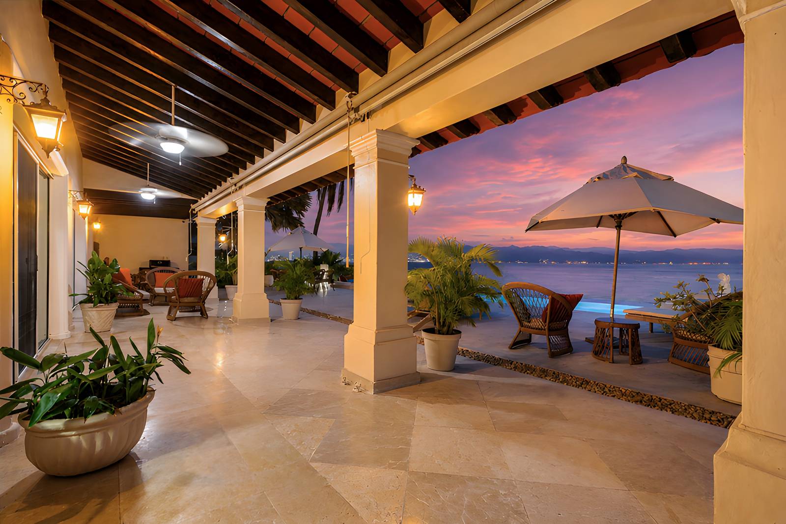 Covered loggia at sunset with the bay beyond