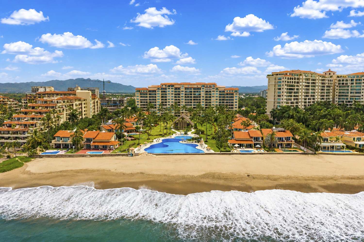Aerial view from the water of the beach and the Condominios Caracoles villas