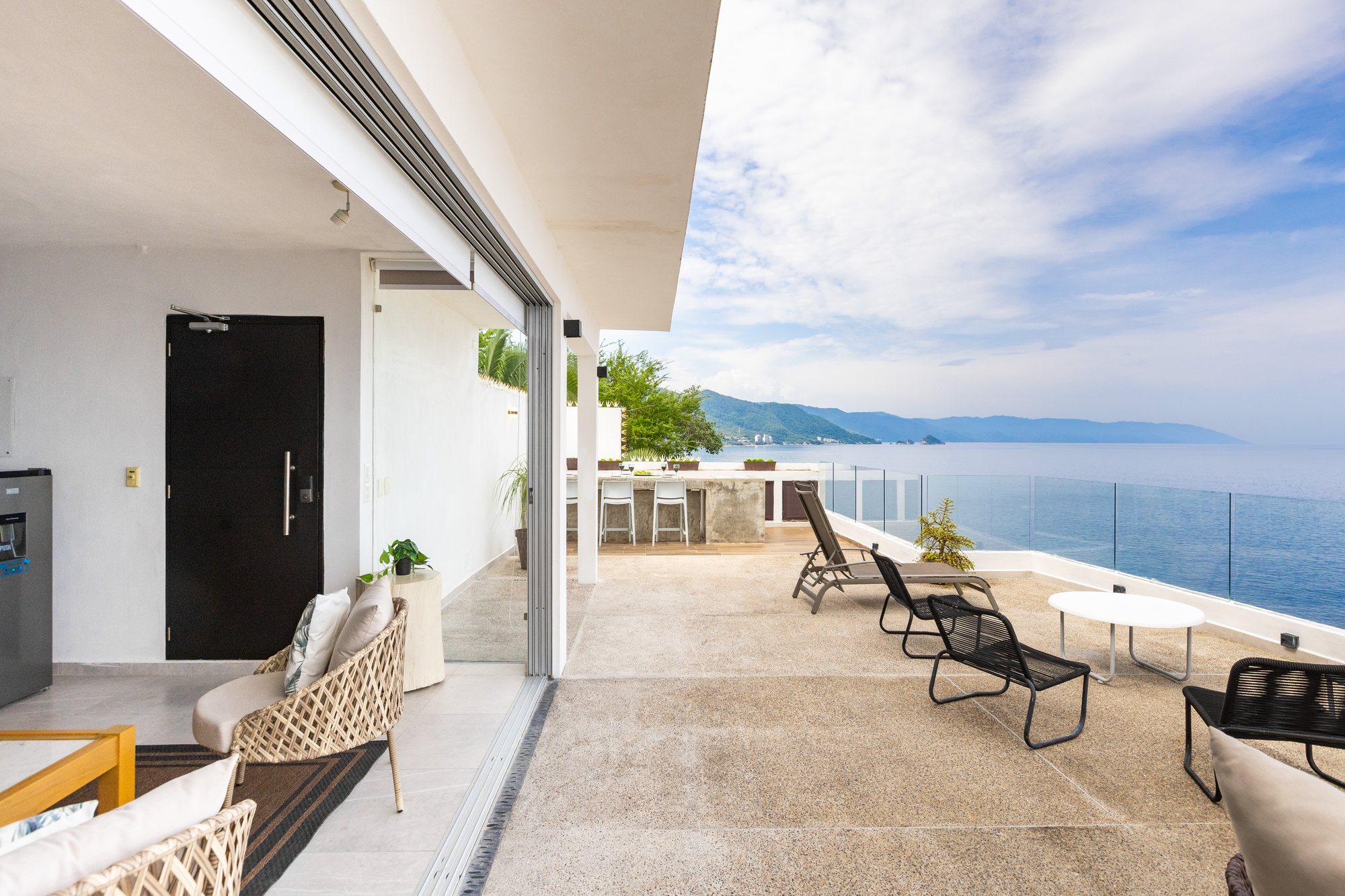 Upper terrace seen from the lounge, with the ocean beyond