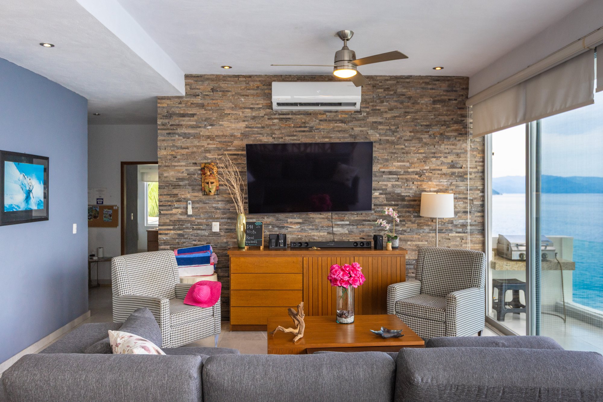 Living room with a stone feature wall