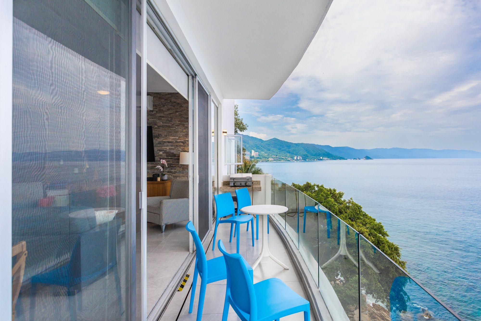 Private balcony with a glass rail along the coast