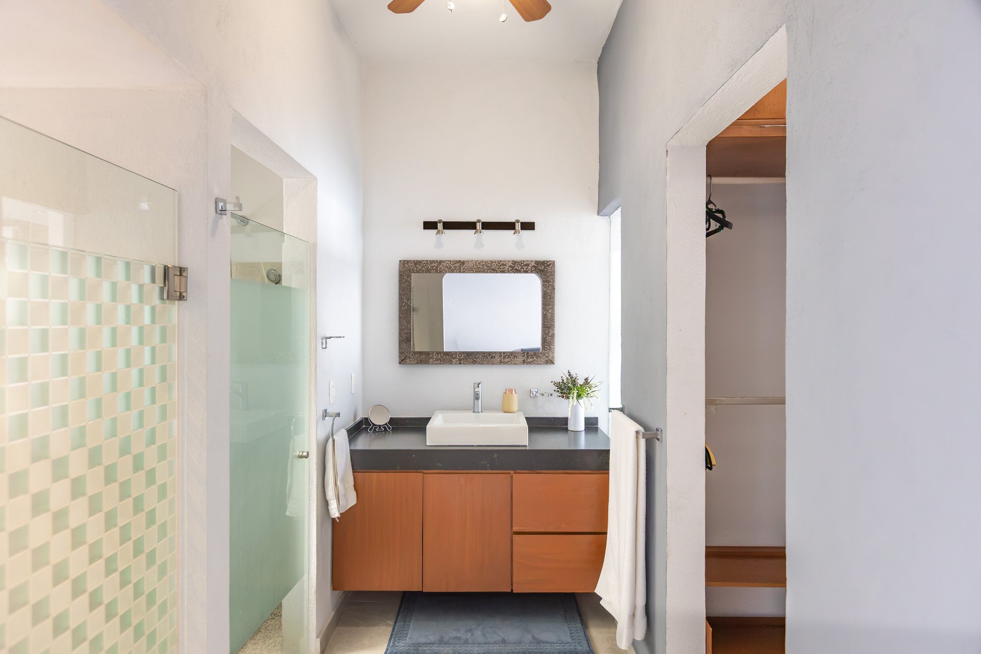 Bathroom with a vessel sink and glass shower