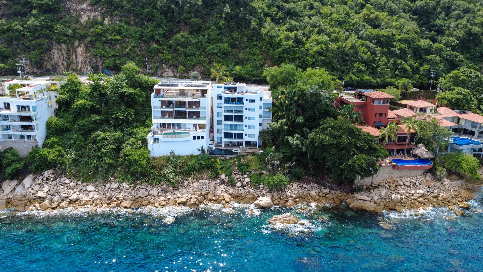Aerial view of Vista Real on the rocks above the Pacific, below the jungle