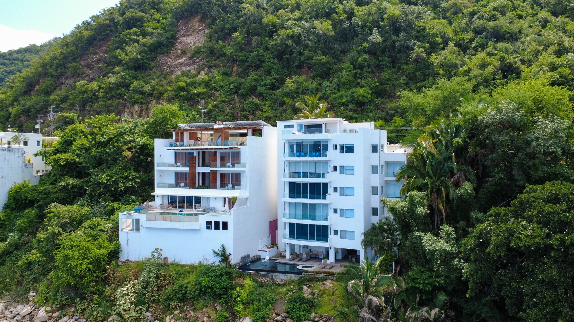 Vista Real from the water, five residences on the cliff