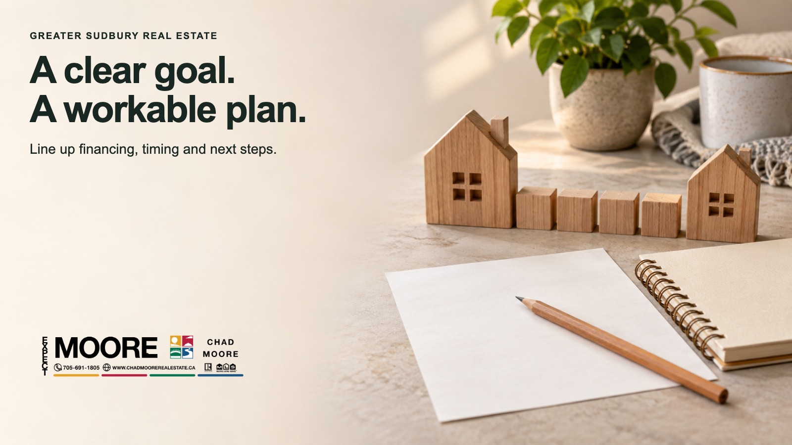 Small house models beside a notebook for a home-move plan