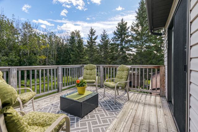 Second deck seating area adjoining the house
