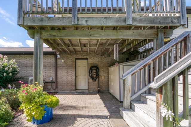 Lower walkout and patio beneath the deck