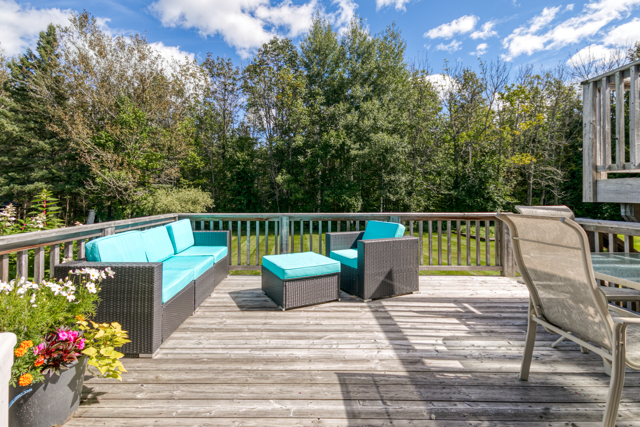 Deck seating with views toward the trees