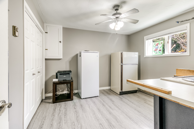Additional lower-level room, currently used as workspace