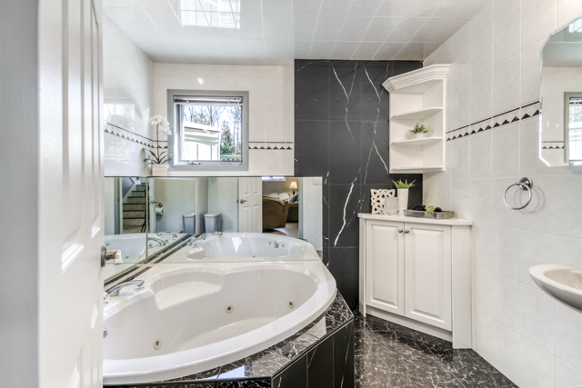 Lower-level bathroom with soaker tub