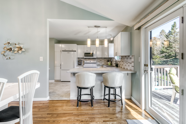 Kitchen, breakfast bar and dining-room walkout