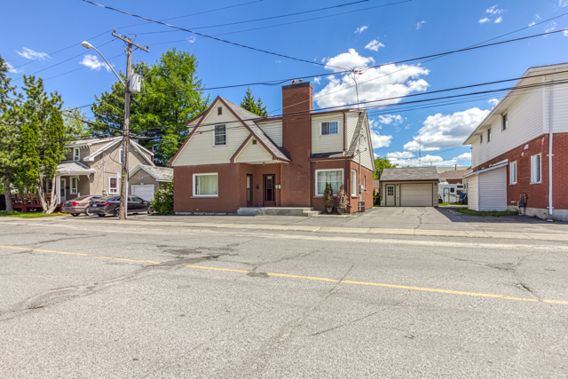 Street view of 488 Clinton Avenue and its detached garage
