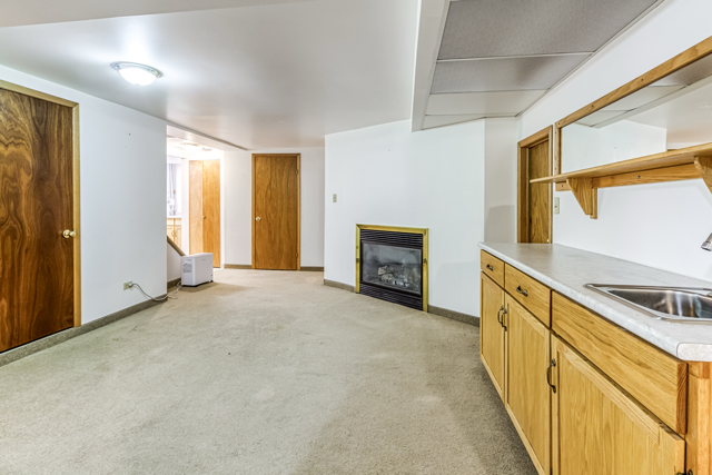 Lower recreation room with natural-gas fireplace