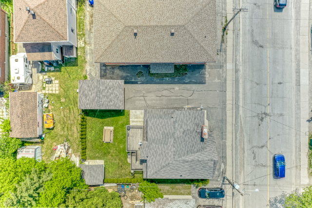Top-down view of 488 Clinton Avenue, driveway, garage and yard