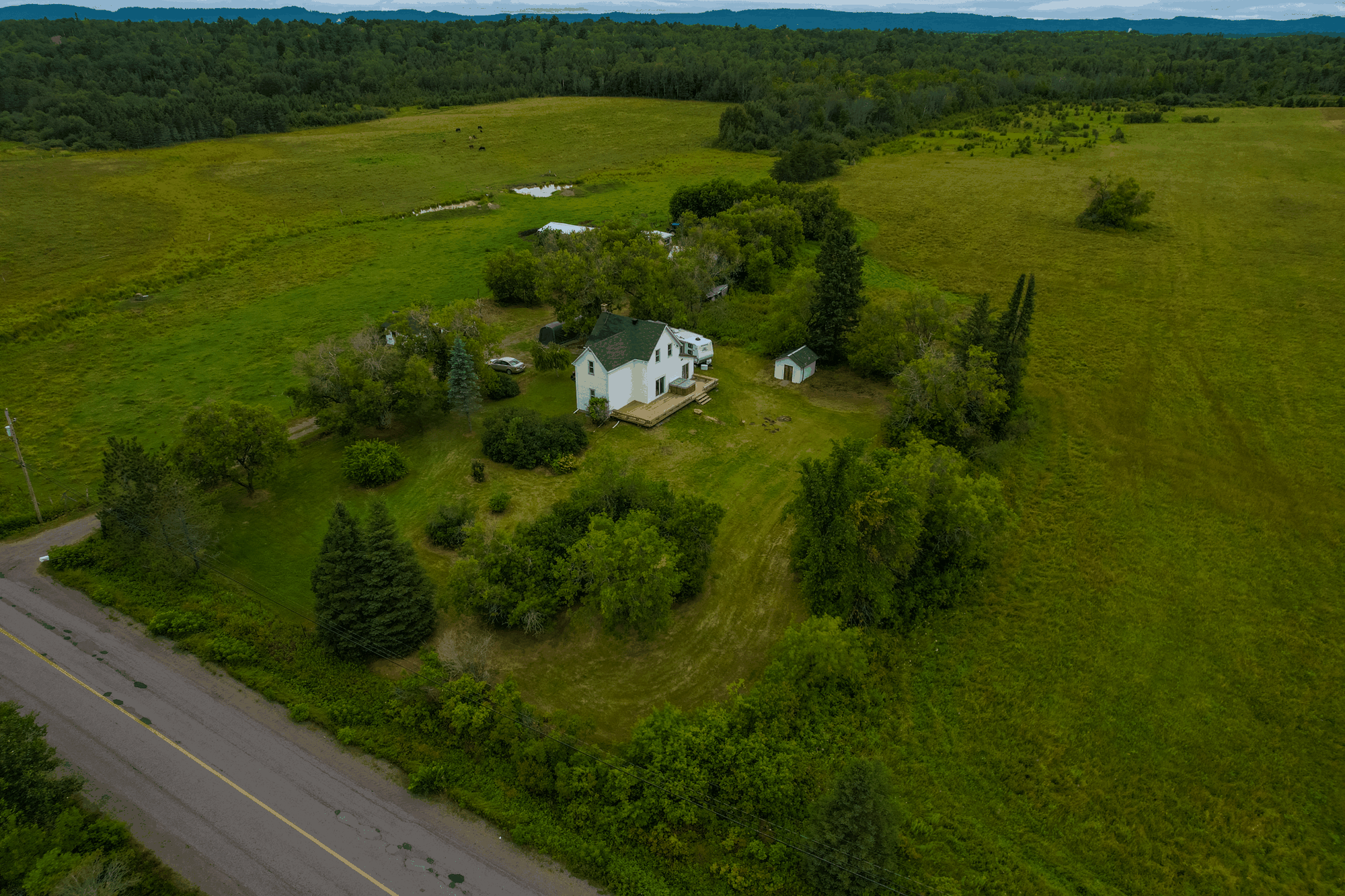 Aerial view of the house and surrounding rural property at 1608 Vermilion Lake Road