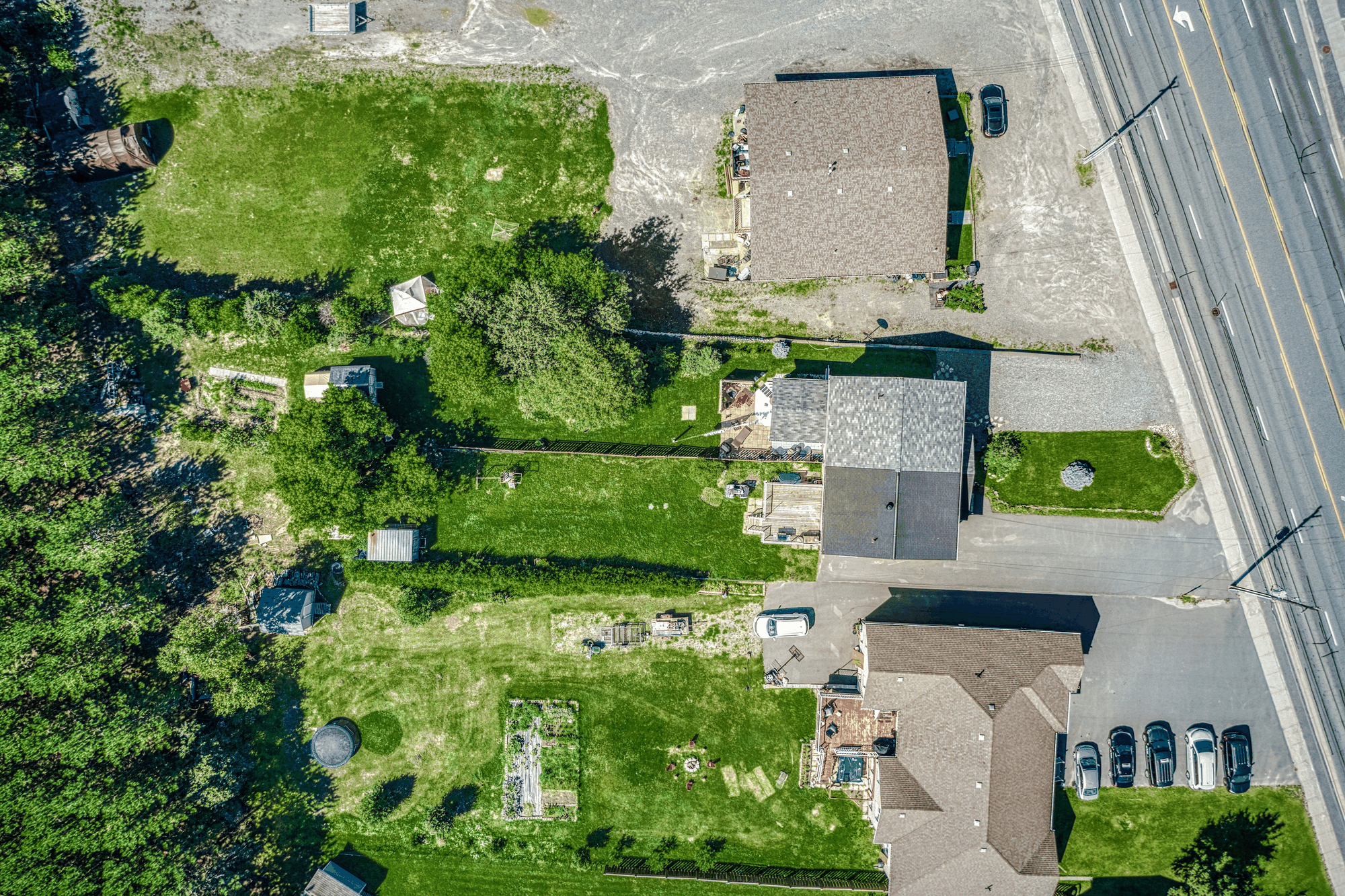 Top-down aerial view of the home and long rear property