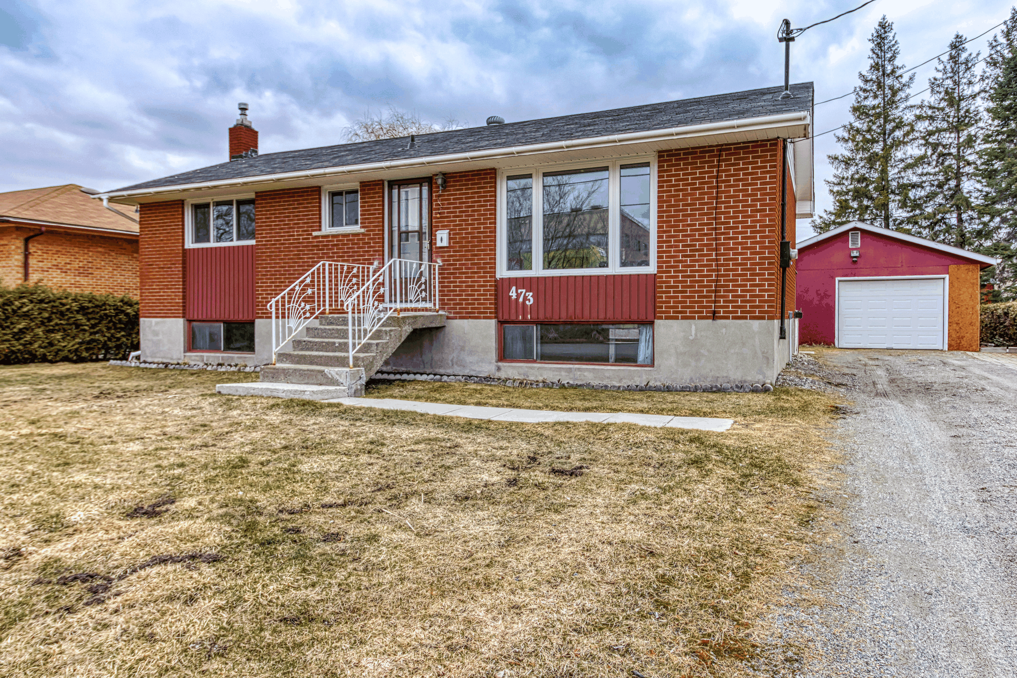 Front exterior of the bungalow and detached garage at 473 Linda Street