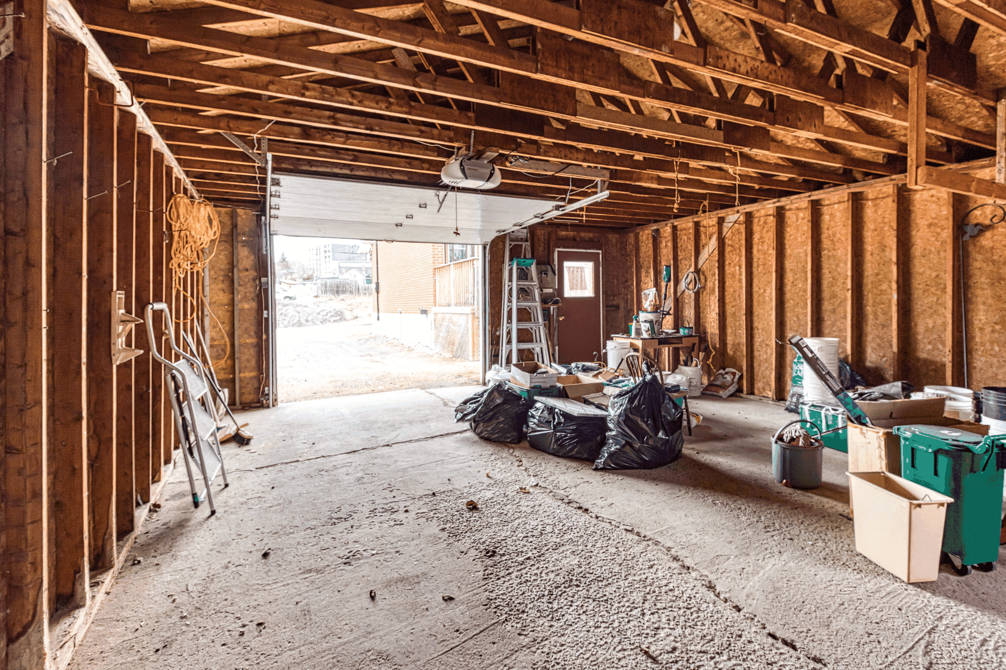 Interior of the detached garage with exposed framing