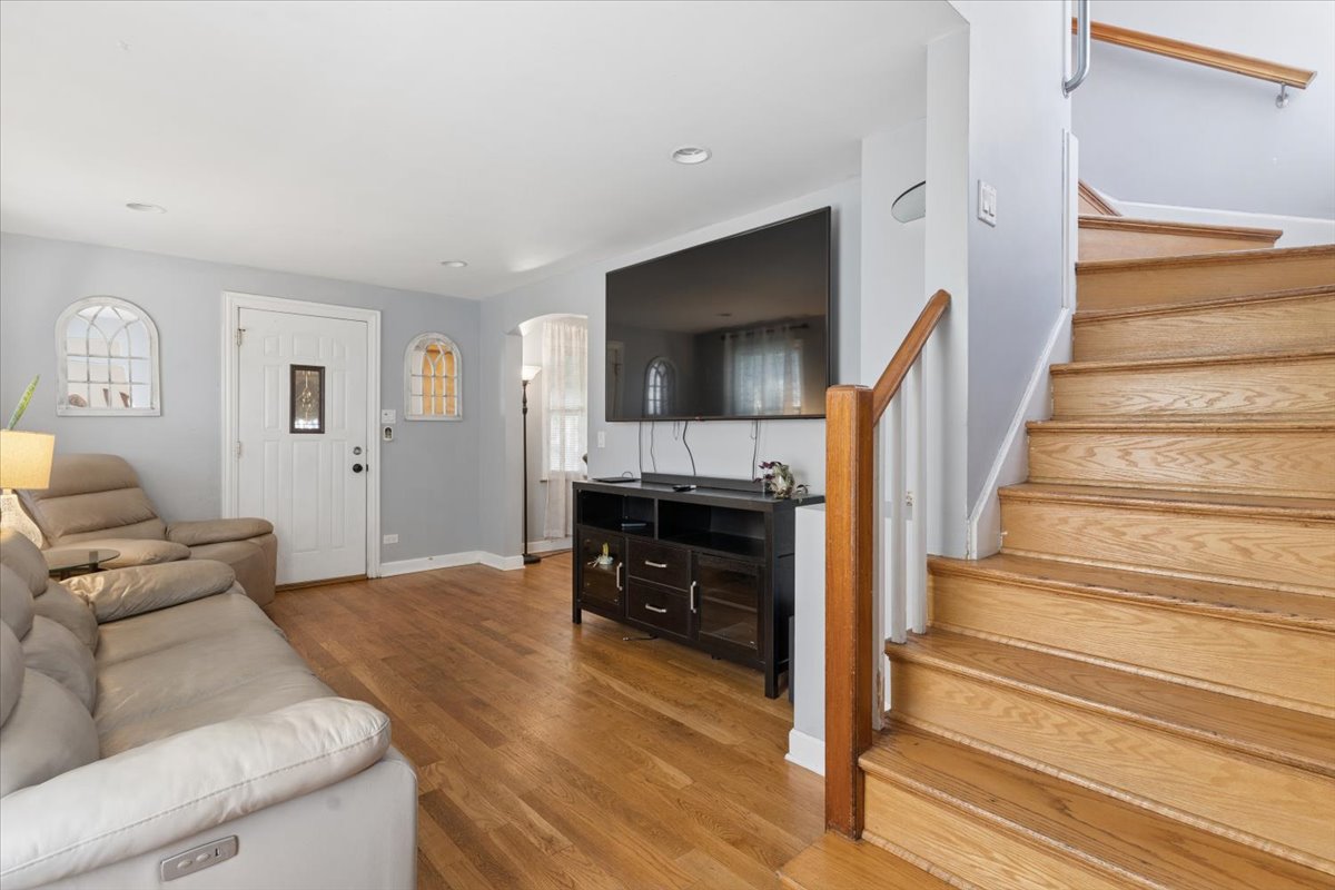 Living room and staircase inside recently sold Franklin Park home