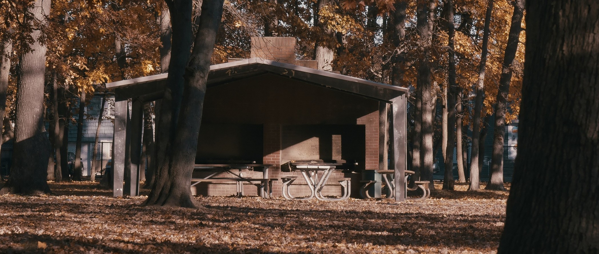 Autumn leaves and a picnic shelter at Marjorie R. Post Community Park