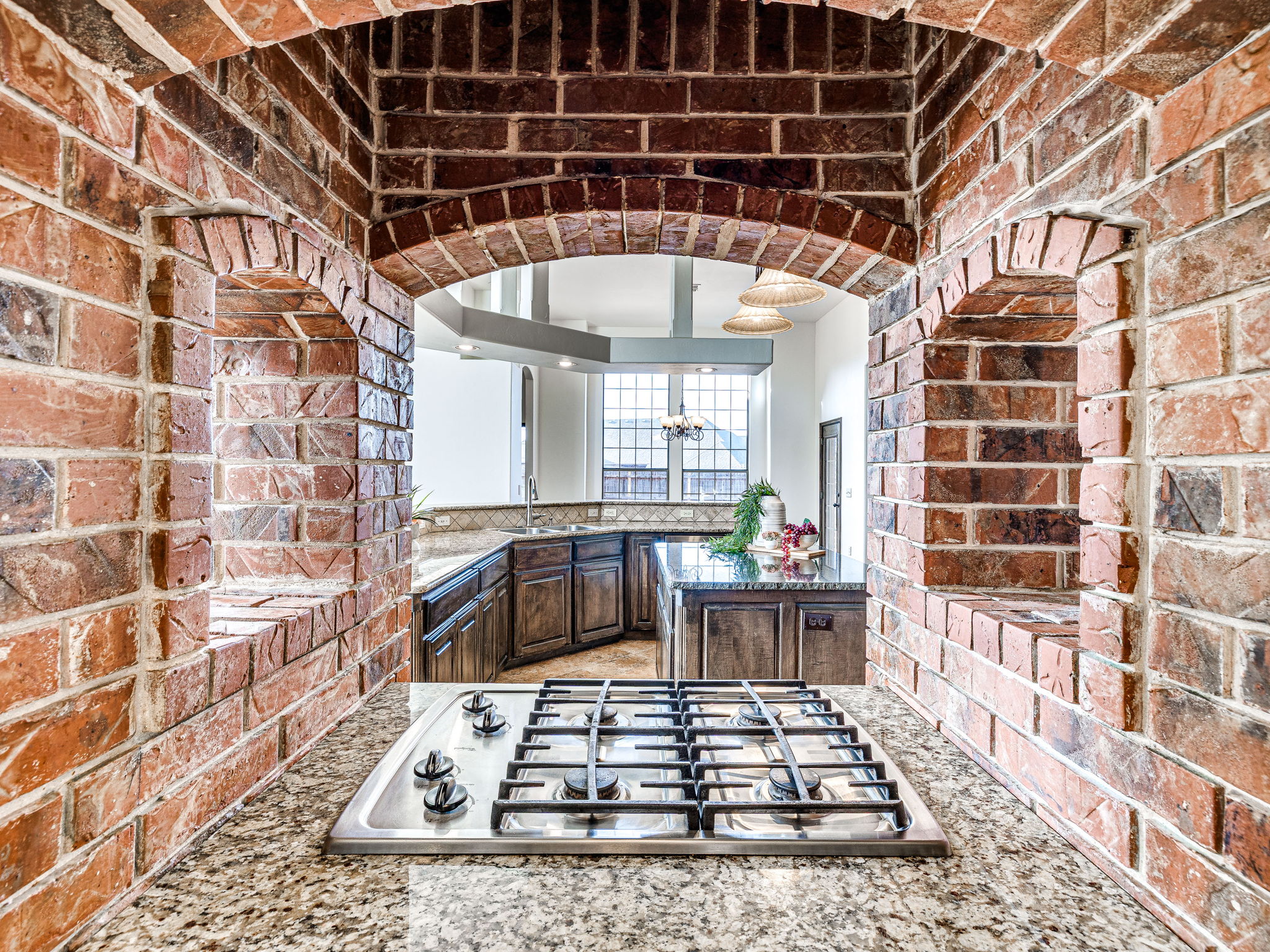 Brick arch gas cooktop in Edmond Oklahoma Home