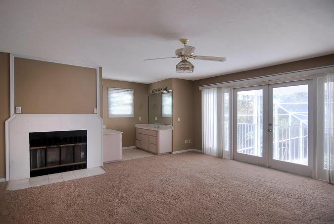 Master bedroom, with balcony, fireplace, and huge custom closet