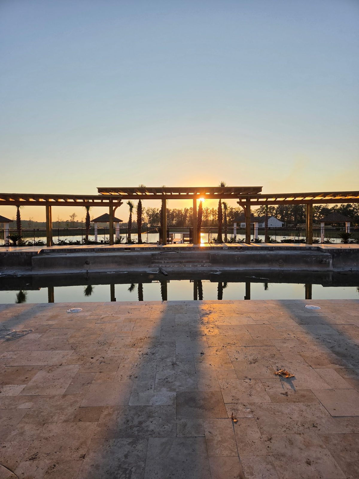 Sunset through the pergolas at The Oasis looking toward Lake Terrapin