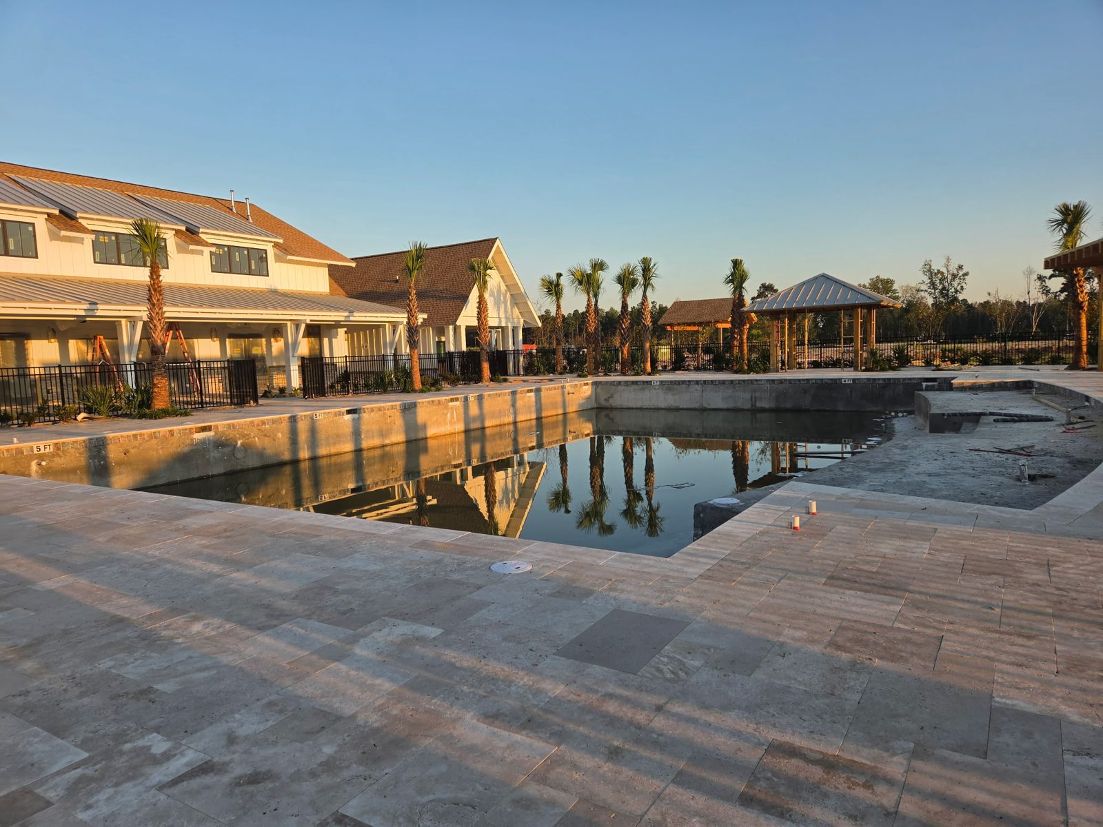 Pool deck and cabanas under construction at The Oasis