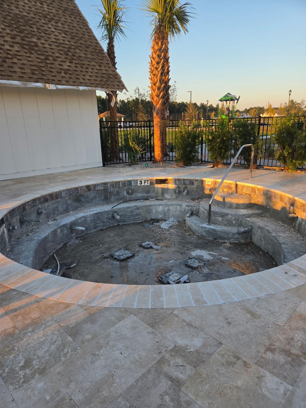 Spa under construction at The Oasis with a playground in the background