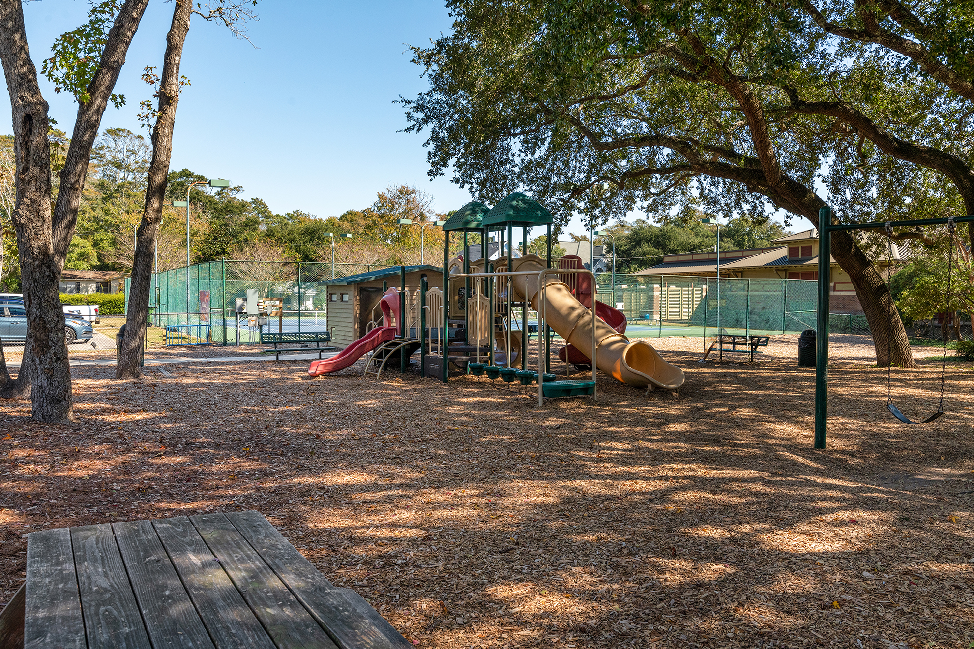 A public park in Surfside Beach South Carolina with a playground, picnic area, and tennis courts