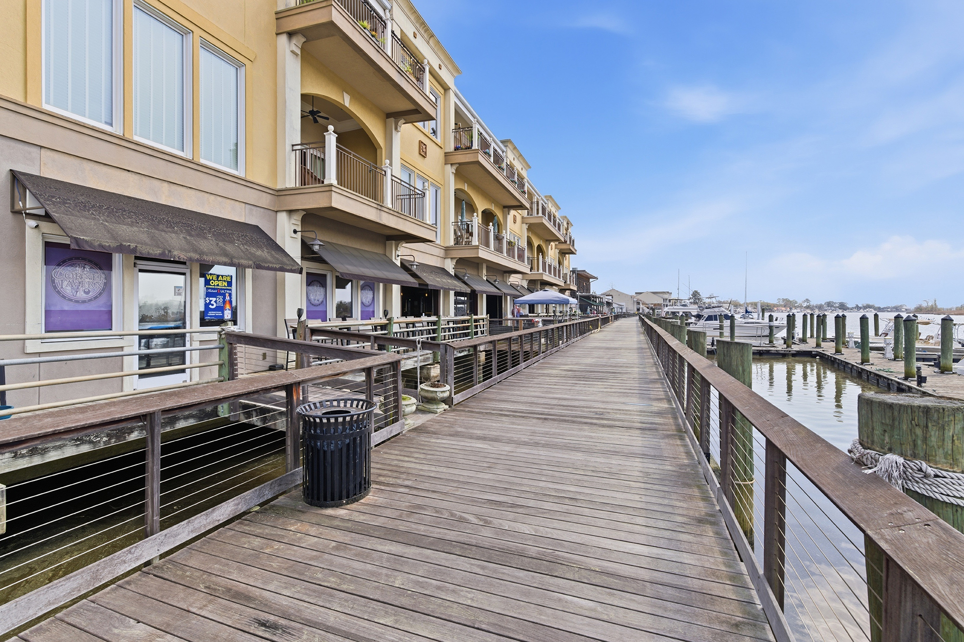 The Harborwalk in Georgetown SC features scenic views of the Sampit River with waterfront condos, marinas, and docked boats. Located in the heart of the Georgetown Historic District, this area is a popular destination for residents and visitors enjoying coastal living in historic downtown Georgetown.