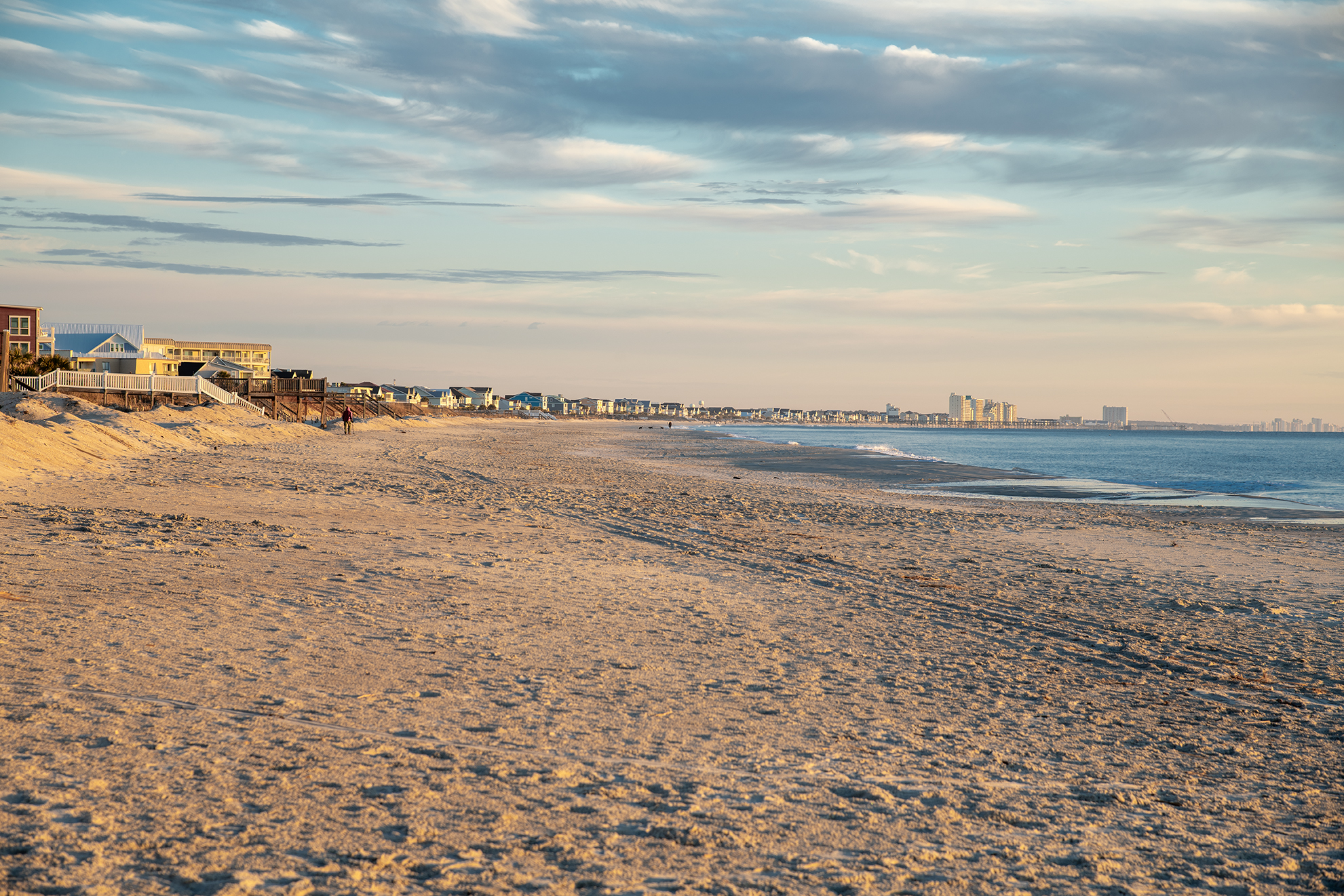 A beautiful shoreline with sandy Beach and an amazing view of the blue waters of the Atlantic Ocean in Pawleys Island, South Carolina