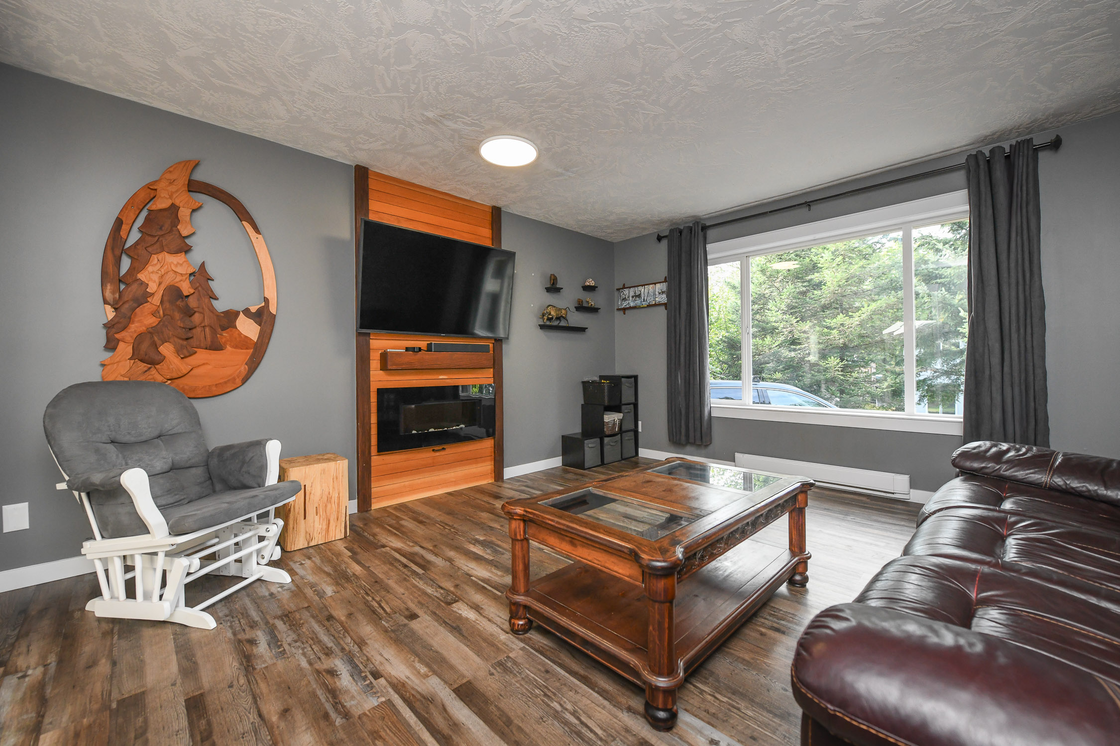 living room of 1102b 1st st courtenay bc half duplex across from puntledge park with private driveway and green space views