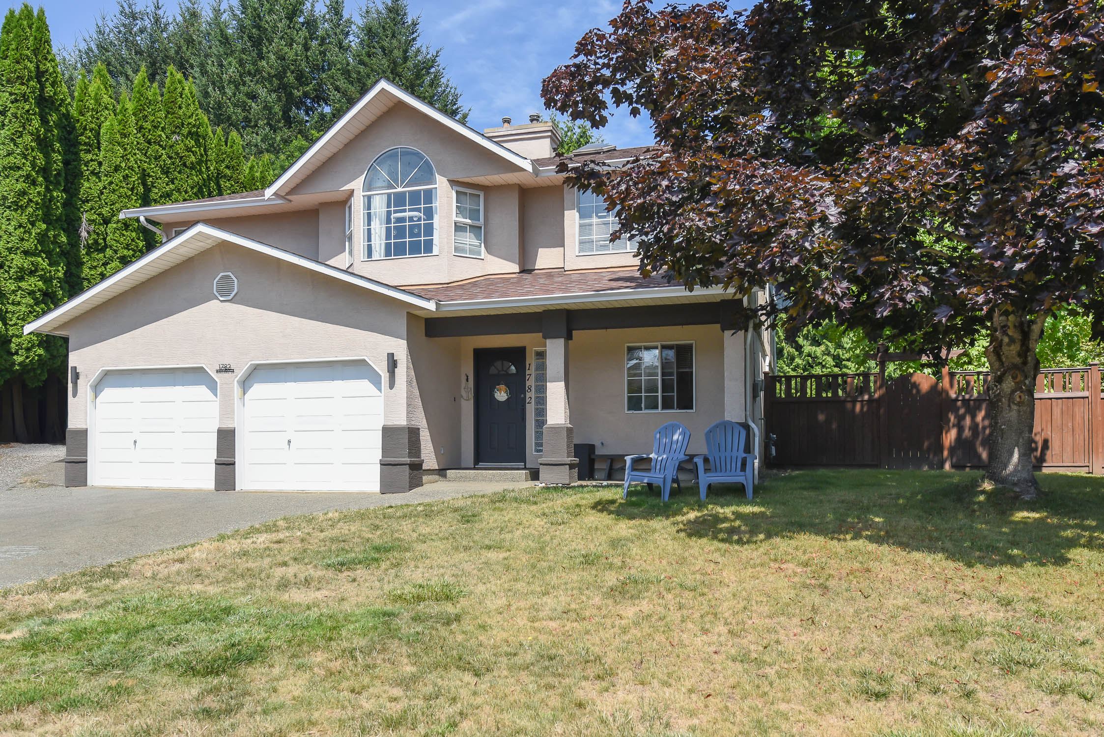 Beautifully maintained family home at 1782 Mallard Dr in East Courtenay featuring mountain views, a renovated kitchen with quartz countertops, vaulted ceilings, a private fenced backyard, and a self-contained in-law suite.