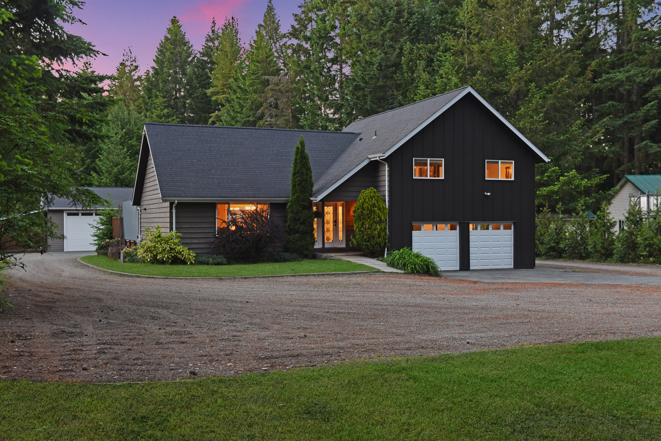 Fully renovated home at 1940 Ryan Rd in the Comox Valley featuring a massive detached workshop, outdoor pool, entertaining deck, and beautifully landscaped private acreage property.