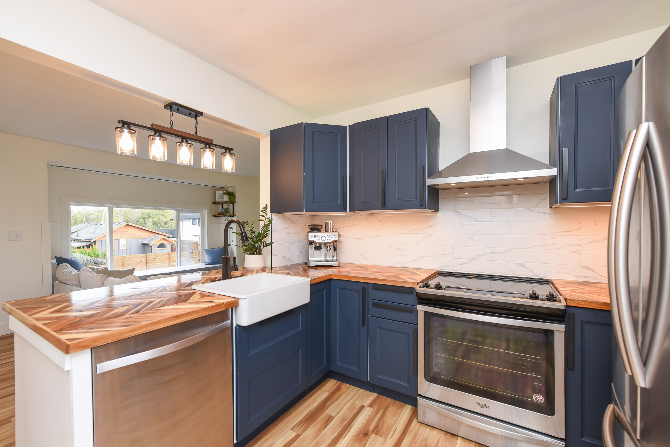 bright renovated kitchen at 1971 19th st courtenay bc featuring modern cabinetry new flooring and updated finishes