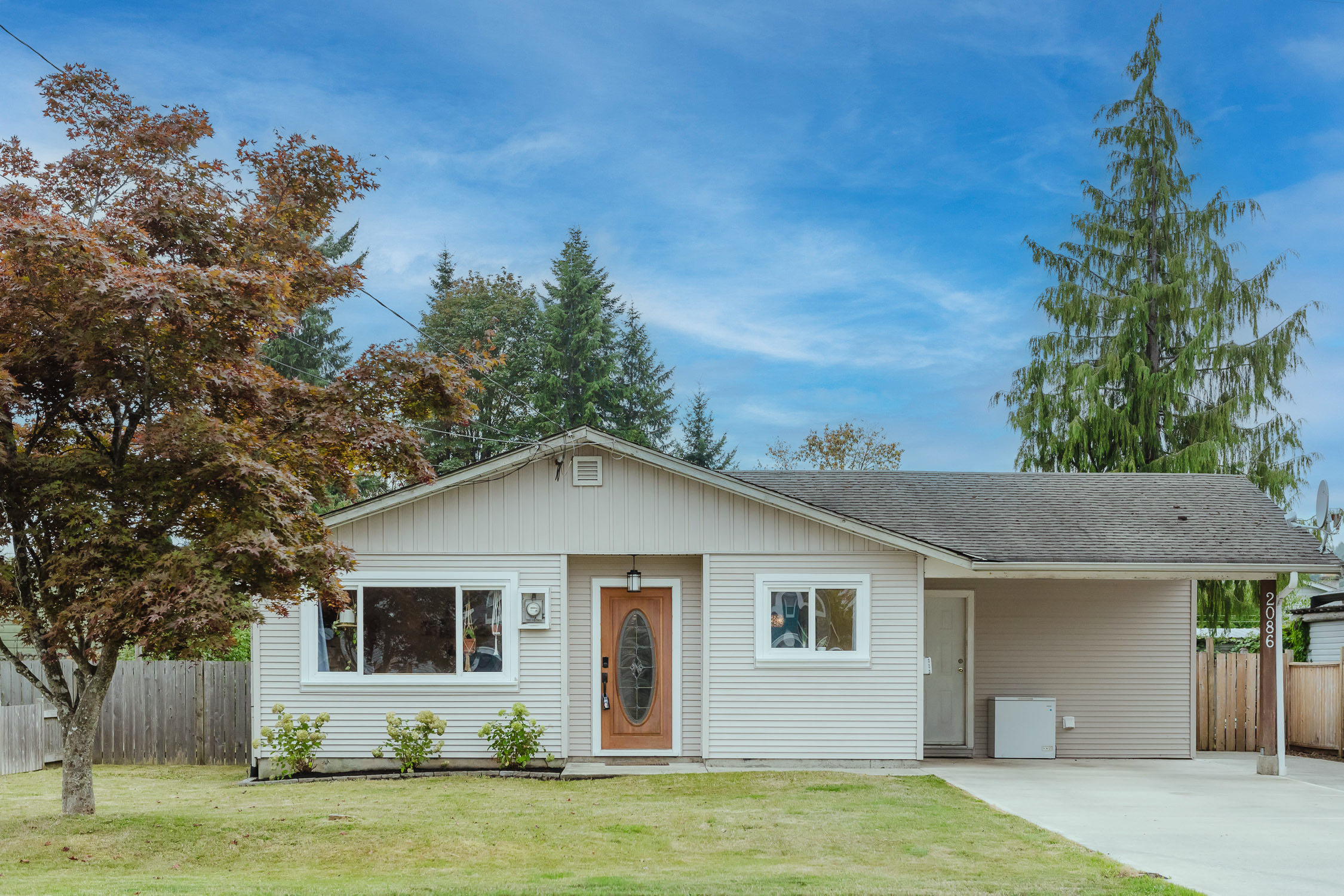 Bright rancher at 2086 Eardley Rd in Campbell River's Willow Point area featuring updated interiors, smart home technology and a fully fenced low-maintenance backyard.