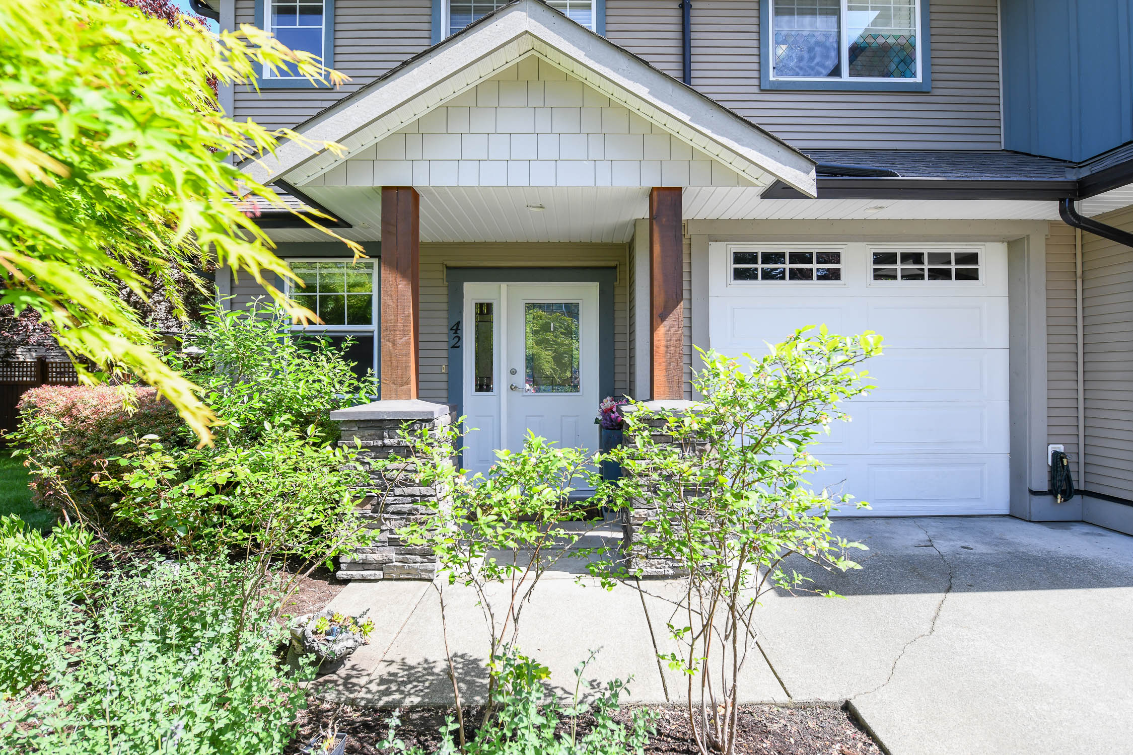 end unit townhome at 42 2112 cumberland rd courtenay bc backing onto creek with fenced yard and private setting