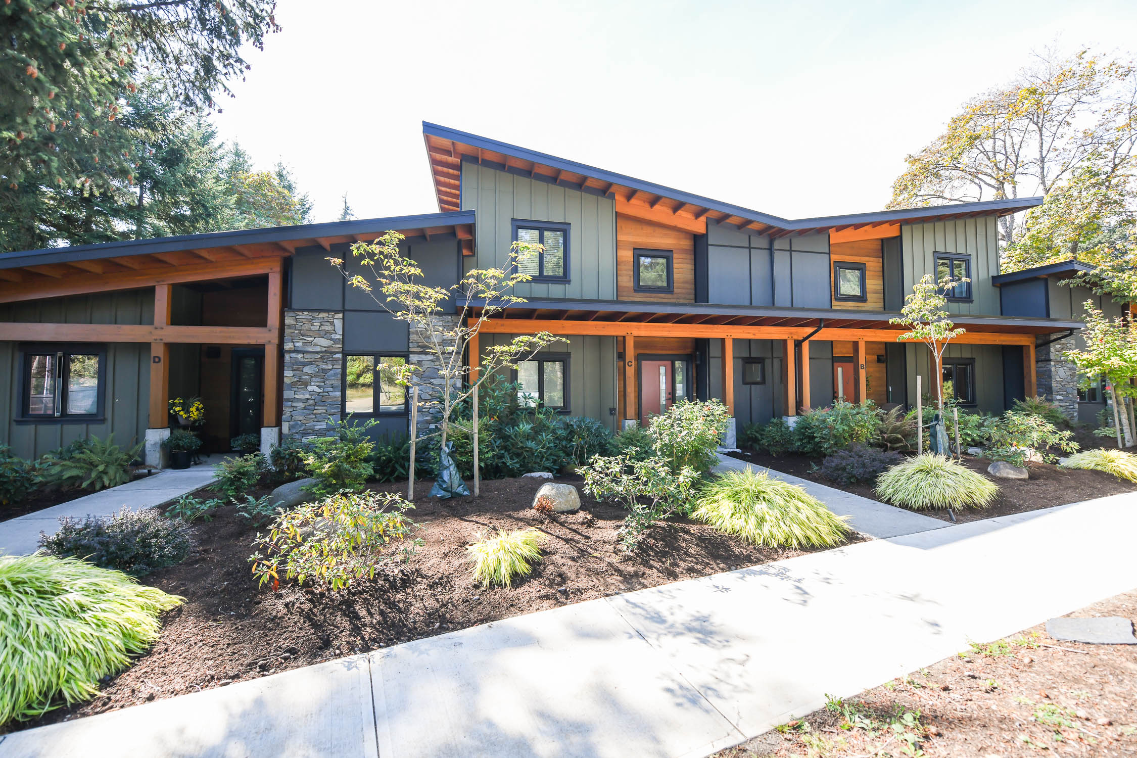 West Coast contemporary home at 221C Glacier View Dr featuring soaring ceilings, expansive windows, engineered hardwood flooring, a gourmet kitchen and a peaceful setting near ocean access.